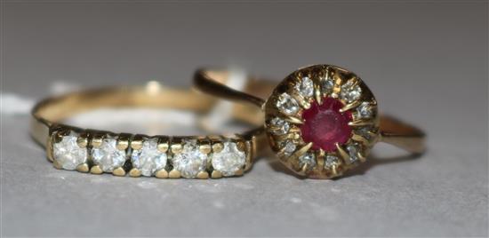 A ruby and diamond cluster ring and one other ring.